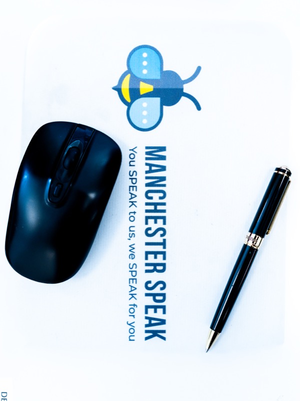 Manchester Speak branded mousepad with mouse and pen